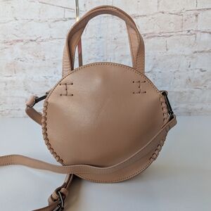 Lucky Brand The Point Leather Circle Bag in a blush or tan color